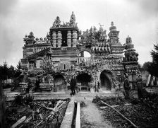 Ferdinand Cheval in front of his Palais Idéal, c. 1890. Creator: Anonymous