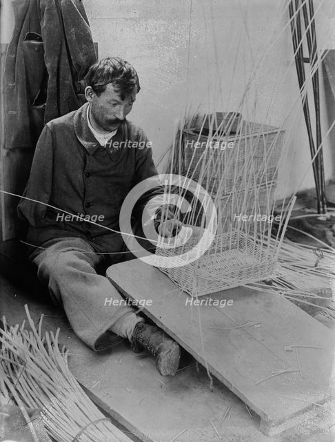 Fernand Bihery [making baskets, French School for crippled soldiers], 1918. Creator: Bain News Service.