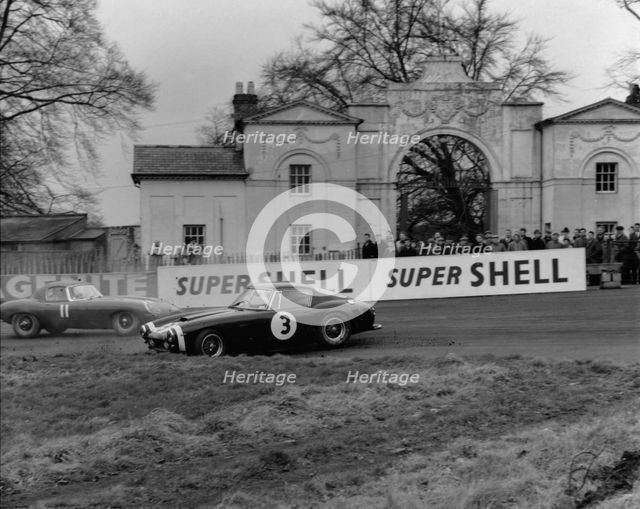 Ferrari 250 SWB spins as Jaguar E type passes. Creator: Unknown.