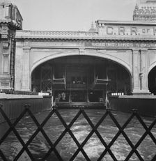 Ferry slip seen from ferry which transports passengers across the Hudson..., New York City, 1939. Creator: Dorothea Lange