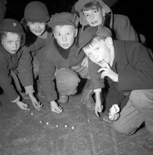 Five boys play marbles, Landskrona, Sweden, 1955