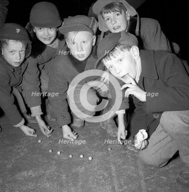 Five boys play marbles, Landskrona, Sweden, 1955. Creator: Unknown.