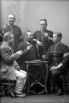 Five men drinking in the photographer's studio, Landskrona, Sweden, 1910. Creator: Unknown