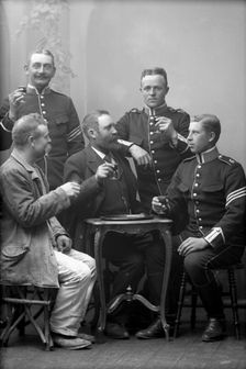 Five men drinking in the photographer's studio, Landskrona, Sweden, 1910. Creator: Unknown