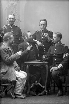 Five men drinking in the photographer's studio, Landskrona, Sweden, 1910