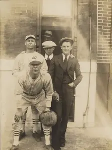 Five men, two in baseball uniforms, about 1926. Creator: John Frank Keith