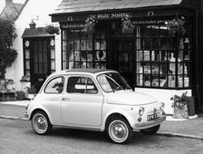Fiat 500 parked outside a quaint shop, 1969