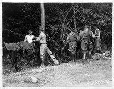 Field Artillery cadets cleaning harnesses on a training hike, Fort Sheridan, Illinois, USA, 1920