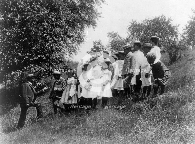 Field-trip - school children outdoors listening to man, DC Public School, 8th Division (?), (1899?). Creator: Frances Benjamin Johnston.