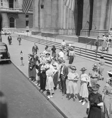 Fifth Avenue at Saint Patrick's Cathedral, waiting for an uptown bus, New York City, 1939. Creator: Dorothea Lange