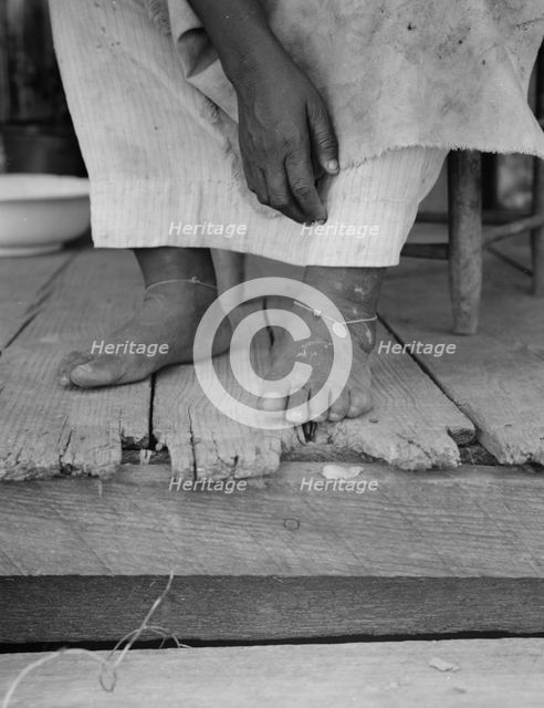 Fifty-seven year old sharecropper woman, Hinds County, Mississippi, 1937. Creator: Dorothea Lange.