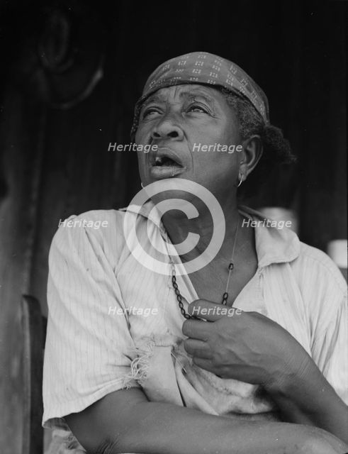 Fifty-seven year old sharecropper woman, Hinds County, Mississippi, 1937. Creator: Dorothea Lange.