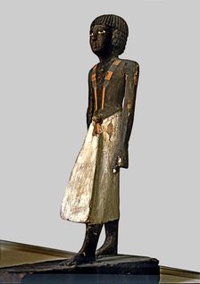 Figurine of a man for a tomb, made of polychromed wood, side view