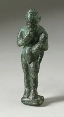Figurine of a Standing Naked Man Holding a Baby, Ptolemaic Period-early Roman Period 200 BCE-100 CE. Creator: Unknown