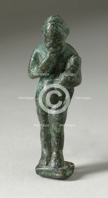 Figurine of a Standing Naked Man Holding a Baby, Ptolemaic Period-early Roman Period 200 BCE-100 CE. Creator: Unknown.