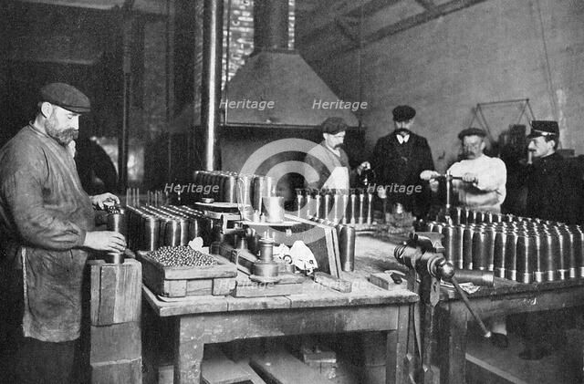 Filling shrapnel shells in a British munitions factory, World War I, 1914-1918. Artist: Unknown
