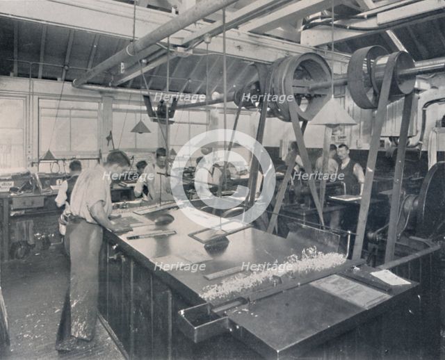 'Final Operations in the Foundry. Trimming the Plates and Finishing', 1917. Artist: Unknown.