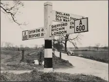 Finger post road sign on the A600 between Bedford and Shefford, Southill, 1940-1960. Creator: George R Long