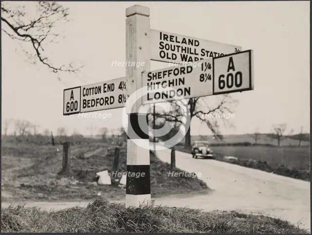 Finger post road sign on the A600 between Bedford and Shefford, Southill, 1940-1960. Creator: George R Long.