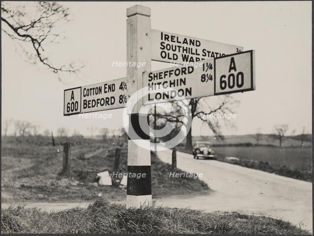 Finger post road sign on the A600 between Bedford and Shefford, Southill, 1940-1960. Creator: George R Long.