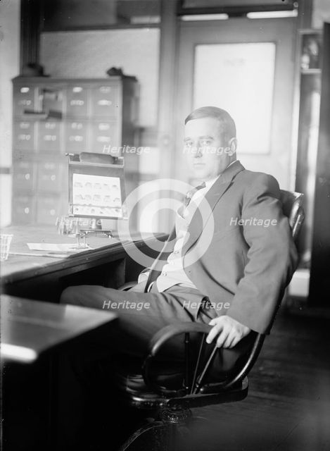 Finger Printing, J.S. Taylor At Bureau of Finger Print, Navy Department, 1912. Creator: Harris & Ewing.