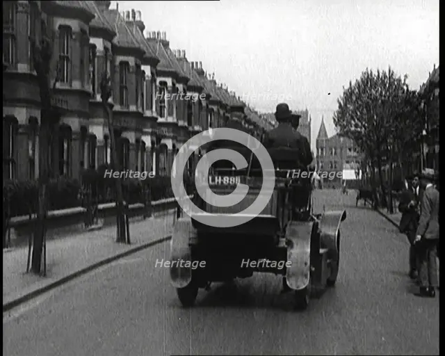 Fire Engine Driving Down the Street, 1920. Creator: British Pathe Ltd.