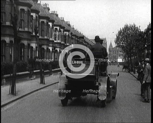 Fire Engine Driving Down the Street, 1920. Creator: British Pathe Ltd.