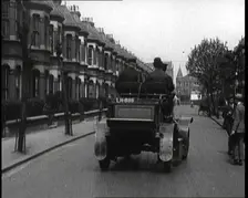 Fire Engine Driving Down the Street, 1920. Creator: British Pathe Ltd
