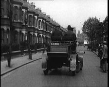 Fire Engine Driving Down the Street, 1920. Creator: British Pathe Ltd