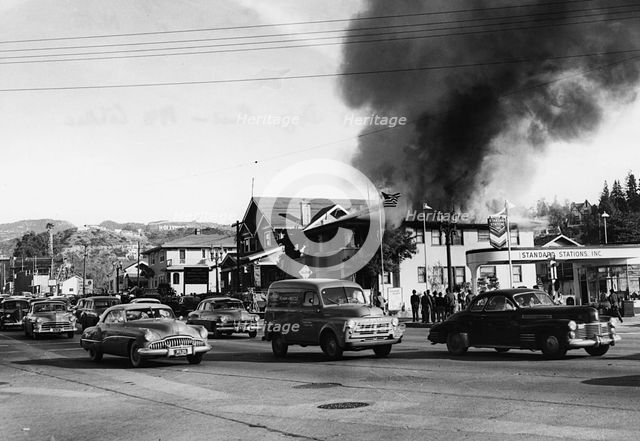 Fire in building causing traffic to slow, Glendale, Burbank, California 1951. Creator: Unknown.