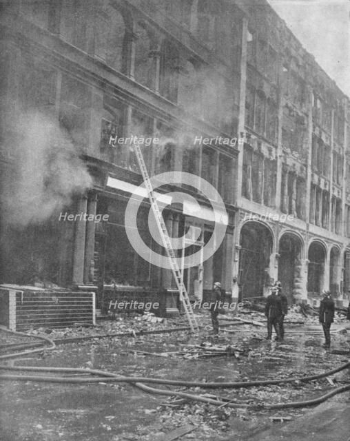 'Firemen Tackle City Blaze', 1940, (1940). Artist: Unknown.