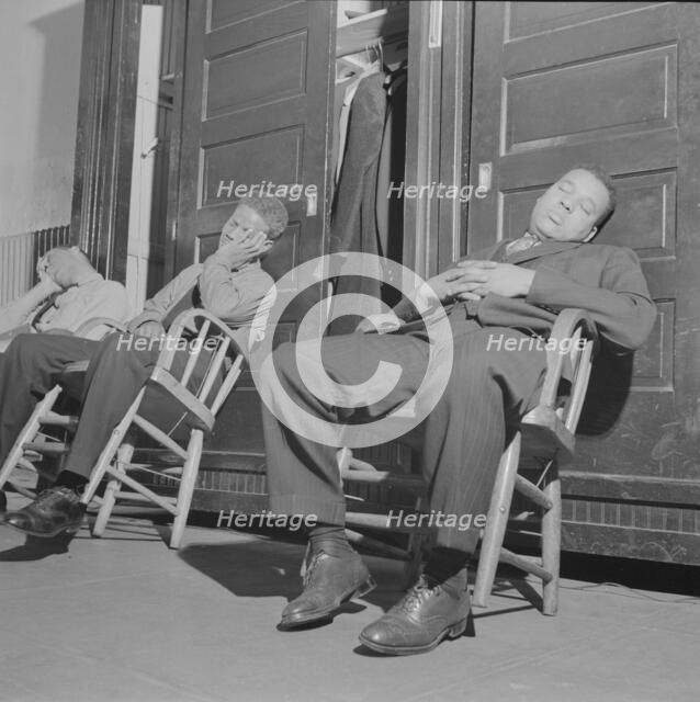 Firemen taking a nap in engine house number four, Washington, D.C, 1943. Creator: Gordon Parks.