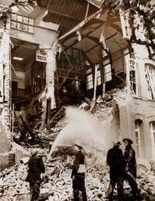 Firemen at work on a children's school, East London, the Blitz, World War II, 13 September 1940. Creator: Unknown