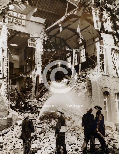 Firemen at work on a children's school, East London, the Blitz, World War II, 13 September 1940. Artist: Unknown