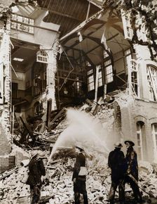 Firemen at work on a children's school, East London, the Blitz, World War II, 13 September 1940