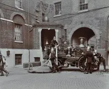 Firemen demonstrating motor steamer hoses, London Fire Brigade Headquarters, London, 1910