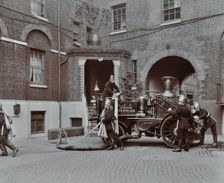 Firemen demonstrating motor steamer hoses, London Fire Brigade Headquarters, London, 1910