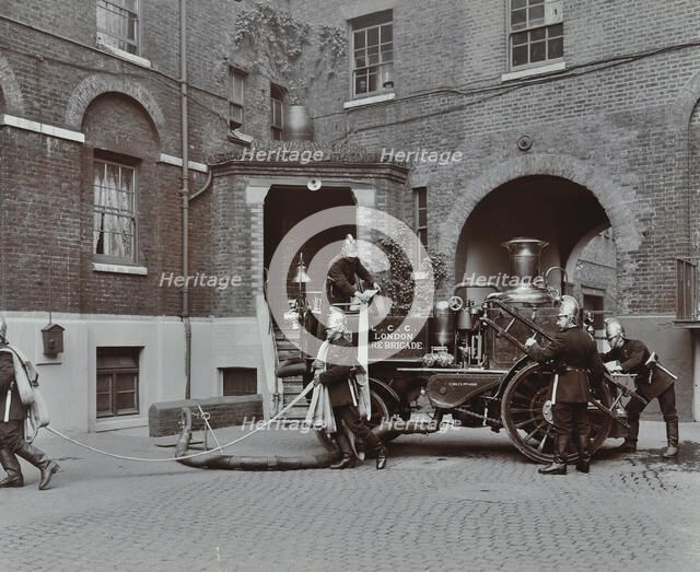 Firemen demonstrating motor steamer hoses, London Fire Brigade Headquarters, London, 1910. Artist: Unknown.