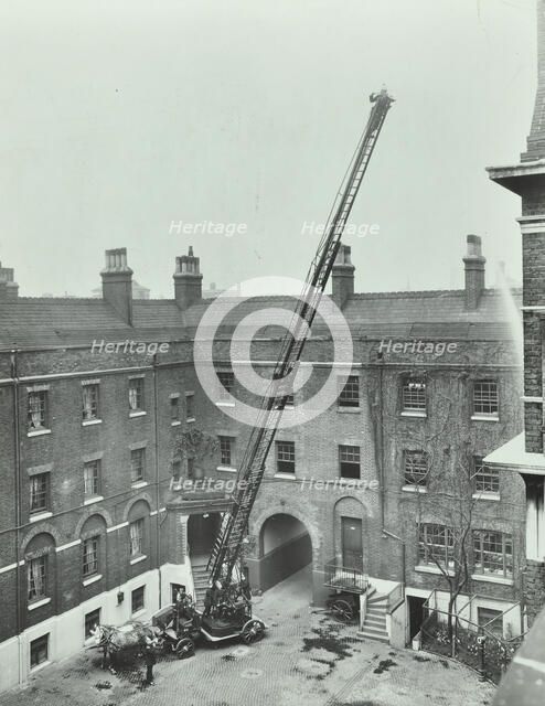 Firemen demonstrating the magirus ladder, London Fire Brigade Headquarters, London, 1910. Artist: Unknown.