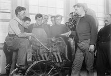 Firemen studying auto motor, between c1910 and c1915. Creator: Bain News Service