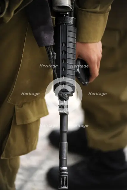 Firearm detail, soldier at the Western Wall, Jerusalem, Israel, 2013. Creator: LTL.