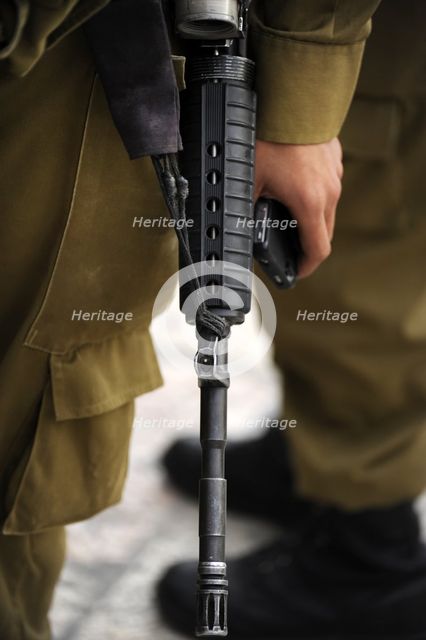 Firearm detail, soldier at the Western Wall, Jerusalem, Israel, 2013. Creator: LTL.