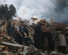 Firefighters Helping an Injured Civilian During the Blitz, 1940. Creator: British Pathe Ltd