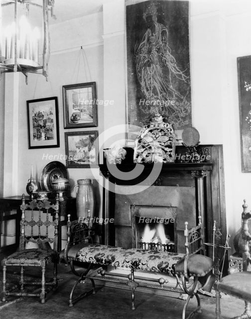 Fireplace, furniture, and works of art in Frances Benjamin Johnston's..., New Orleans, c1920 - 1950. Creator: Frances Benjamin Johnston.