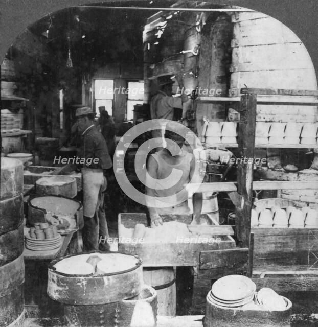 Firing tableware in the Noted Pottery Centre, Trenton, New Jersey, USA, early 20th century. Artist: Keystone View Company