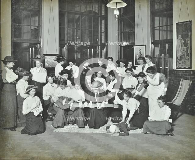 First aid class for women, Montem Street Evening Institute, London, 1913. Artist: Unknown.