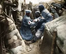 First aid to a wounded man in one of the French trenches 1915