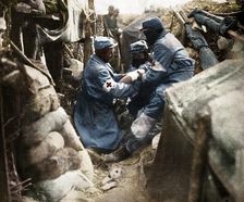 First aid to a wounded man in one of the French trenches 1915