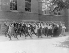 First Division school class exercising with barbells in schoolyard, Washington, D.C., (1899?). Creator: Frances Benjamin Johnston