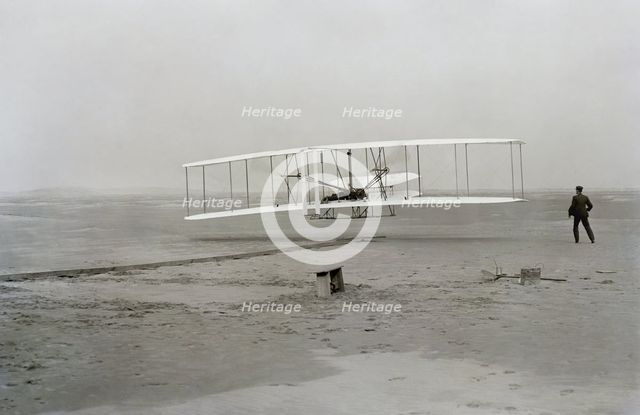 First flight of Wright brothers aircraft, Kitty Hawk, North Carolina, USA, December 17, 1903.  Creator: Unknown.